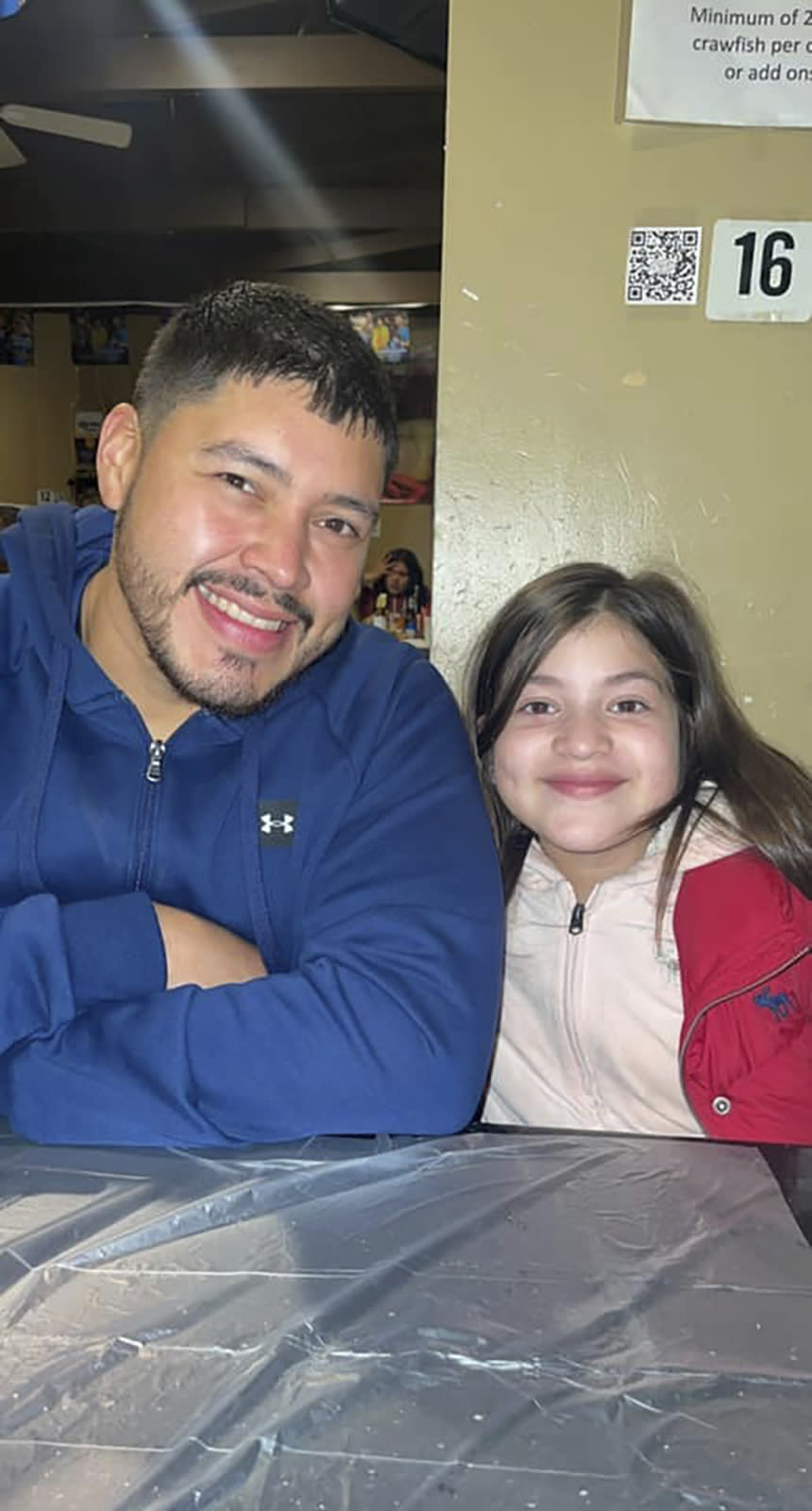 In this undated photo provided by the family of Arlene Alvarez, shows the 9-year-old girl with her father Armando Alvarez. Arlene died on Tuesday, Feb 15, 2022, after being mistakenly shot by a robbery victim on Monday evening in Houston. (Courtesy of the family of Arlene Alvarez via AP)