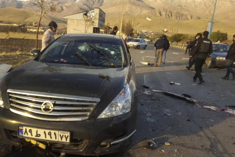 This photo released by the semi-official Fars News Agency shows the scene where Mohsen Fakhrizadeh was killed in Absard, a small city just east of the capital, Tehran, Iran, Friday, Nov. 27, 2020. Fakhrizadeh, an Iranian scientist that Israel alleged led the Islamic Republic's military nuclear program until its disbanding in the early 2000s was “assassinated” Friday, state television said. (Fars News Agency via AP)