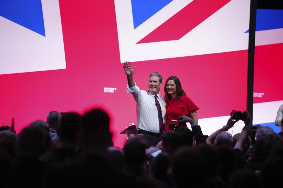 Britain's opposition Labour Party leader Keir Starmer hugs with his wife Victoria after he delivers his keynote speech at the Labour Party conference in Liverpool, England, Tuesday, Oct. 10, 2023.(AP Photo/Jon Super)