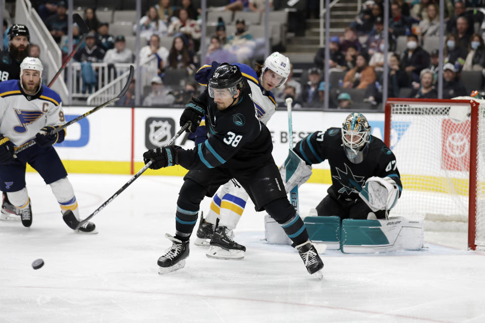 San Jose Sharks left wing Matt Nieto (83) clears the puck against St. Louis Blues left wing Brandon Saad (20) during the second period of an NHL hockey game in San Jose, Calif., Thursday, April 21, 2022. (AP Photo/Josie Lepe)