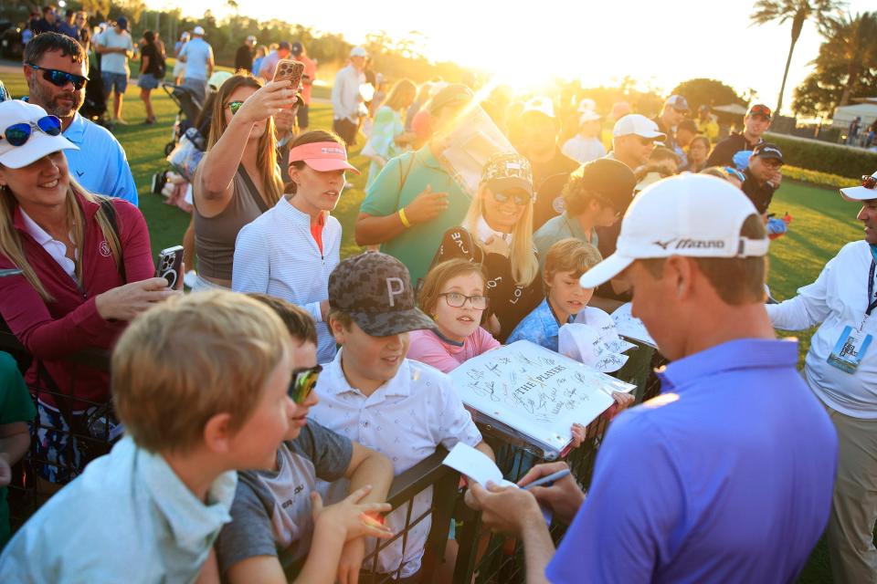 Ben Griffin signs autographs for fans during the third round of the The Players Championship at TPC Sawgrass in Ponte Vedra Beach, Fla., on March 11. "I'm not the flashiest golfer, but I'm a gamer and a grinder,” said Griffin, who hopes to play well this week in Austin and next week in San Antonio to snag a spot in the Masters.