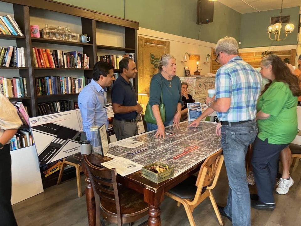 Talking with local residents at a recent 'Coffee with Construction' meeting in Lake Worth Beach are FDOT Senior Consultant Timir Shah (left) and FDOT Consultant Design Project Manager Jagan Katkuri (center) and Lake Worth Beach Mayor Betty Resch.