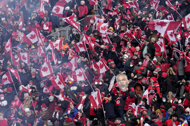 Canada fans cheer from the stands prior to World Cup qualifying soccer action between Canada and the United States in Hamilton, Ontario, Sunday, Jan. 30, 2022. (Frank Gunn/The Canadian Press via AP)