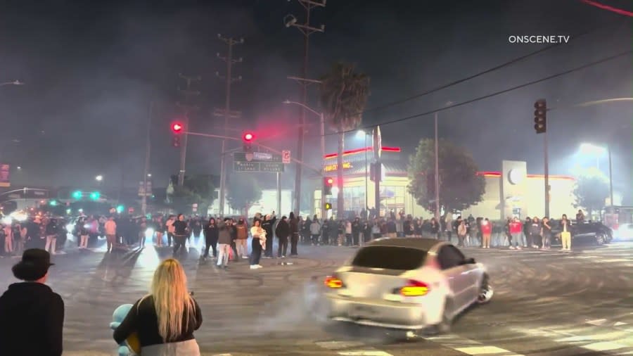 A large group of people gathered in South Los Angeles for an illegal street takeover more than an hour. LAPD says the attendees were driving erratically and setting off fireworks on April 28, 2024. (Onscene.TV)