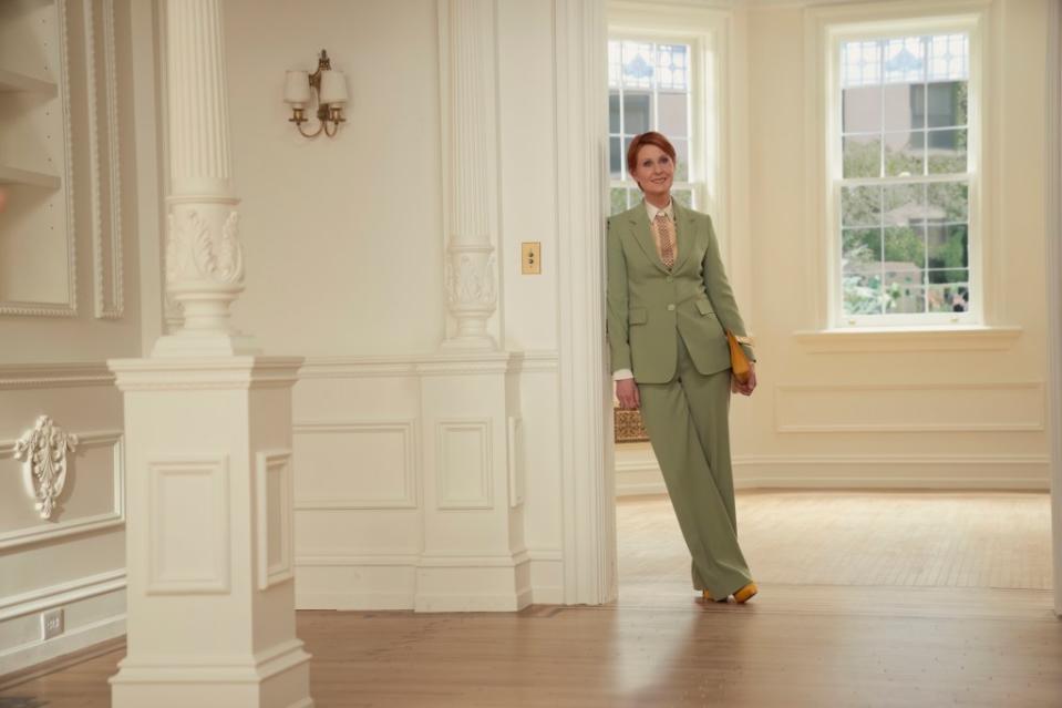 Miranda (Cynthia Nixon) wearing a suit in Carrie's new apartment. 