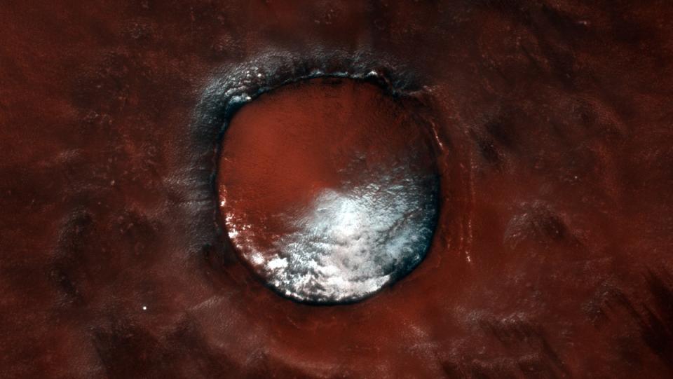 A high-resolution image of a 4 km-wide crater in Mars’ north polar region, which scientists refer to as the Red Velvet crater.