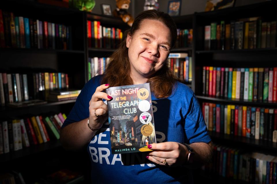 Alyson Browder, a seventh-grade English teacher at Norwalk Middle School, holds a copy of 'Last Night at the Telegraph Club' Thursday, May 2, 2024, in Des Moines.