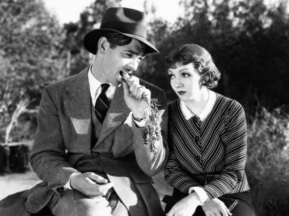 Clark Gable, munching carrots, with Claudette Colbert in ‘It Happened One Night’ (Columbia/Kobal/Rex/Shutterstock)