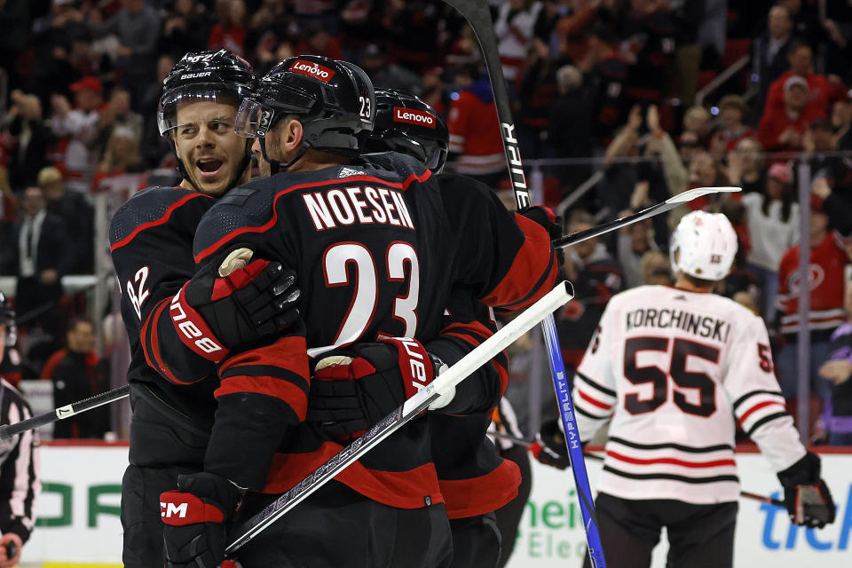 Carolina Hurricanes' Jesperi Kotkaniemi celebrates his goal with teammate Stefan Noesen (23) during the second period of an NHL hockey game against the Chicago Blackhawks in Raleigh, N.C., Monday, Feb. 19, 2024. (AP Photo/Karl B DeBlaker)