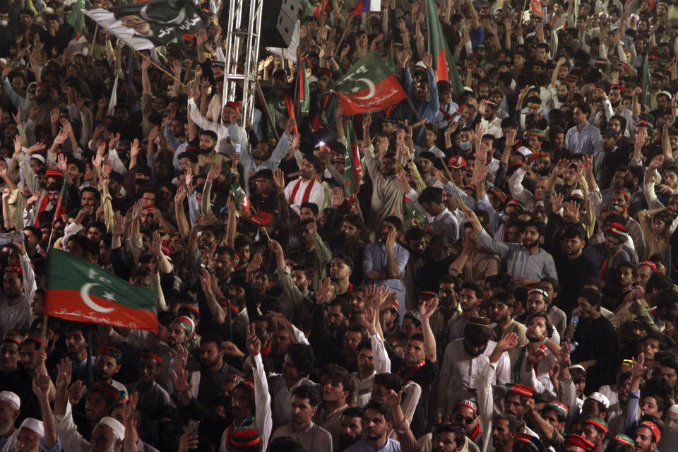 Supporters of Pakistani opposition leader Imran Khan's Tehreek-e-Insaf party attend a rally, in Peshawar, Pakistan, Tuesday, Sept. 6, 2022. Since he was toppled by parliament five months ago, former Prime Minister Imran Khan has demonstrated his popularity with rallies that have drawn huge crowds and signaled to his rivals that he remains a considerable political force. (AP Photo/Mohammad Sajjad)