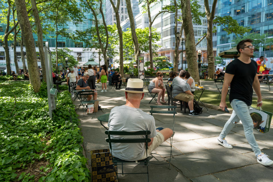 NEW YORK, NEW YORK - MAY 31: People spend an afternoon in Bryant Park in Manhattan on May 31, 2022 in New York City. Temperatures reached the 90s today and are expected to stay warm for the remainder of the week as the summer season begins. (Photo by Spencer Platt/Getty Images)
