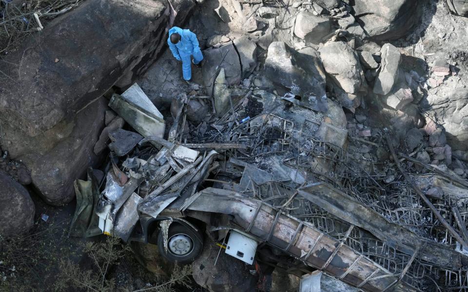 The wreckage off a bus lays in a ravine a day after it plunged off a bridge on the Mmamatlakala mountain pass between Mokopane and Marken, around 300km (190 miles) north of Johannesburg, South Africa