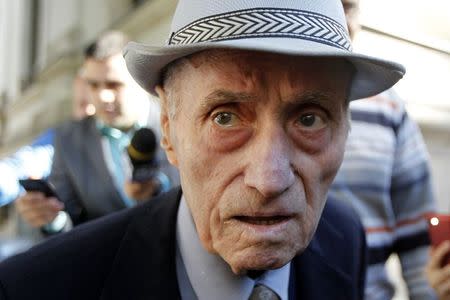 Alexandru Visinescu, the commander of the Ramnicu Sarat prison in eastern Romania between 1956 and 1963 while the country was under communist rule, leaves a court in Bucharest September 24, 2014. REUTERS/Bogdan Cristel