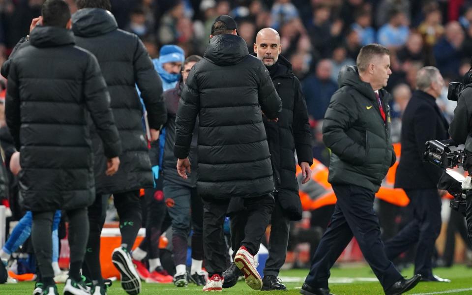 Liverpool manager Jurgen Klopp greets Manchester City manager Pep Guardiola following the Premier League match