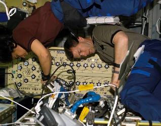 STS-107 astronauts Kalpana Chawla, left, and Rick D. Husband in the Spacehab research module, courtesy of NASA