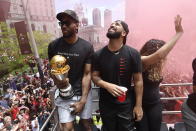 Toronto Raptors forward Kawhi Leonard celebrates with Drake during the NBA basketball championship team's victory parade in Toronto, Monday, June 17, 2019. (Photo by Frank Gunn/The Canadian Press via AP)