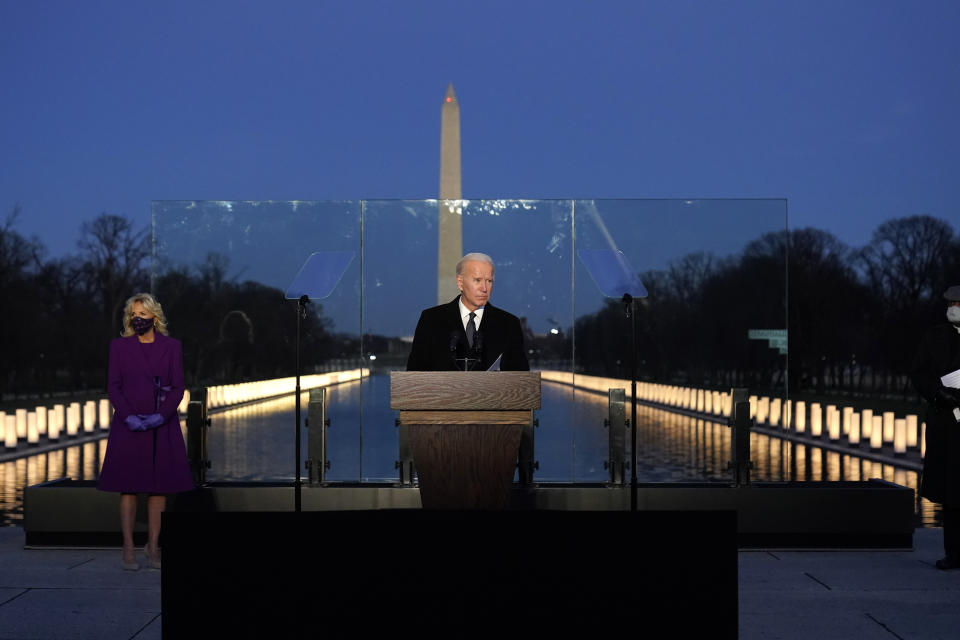 President-elect Joe Biden speaks during a COVID-19 memorial, with lights placed around the Lincoln Memorial Reflecting Pool, Tuesday, Jan. 19, 2021, in Washington. (AP Photo/Alex Brandon)