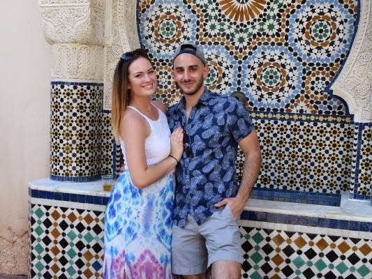 hayley and her boyfriend posing in the morocco pavilion at epcot