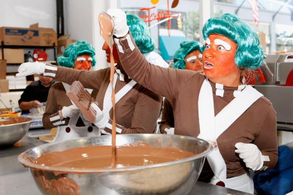 Oompa Loompas whipping up that delicious chocolate (Getty Images)