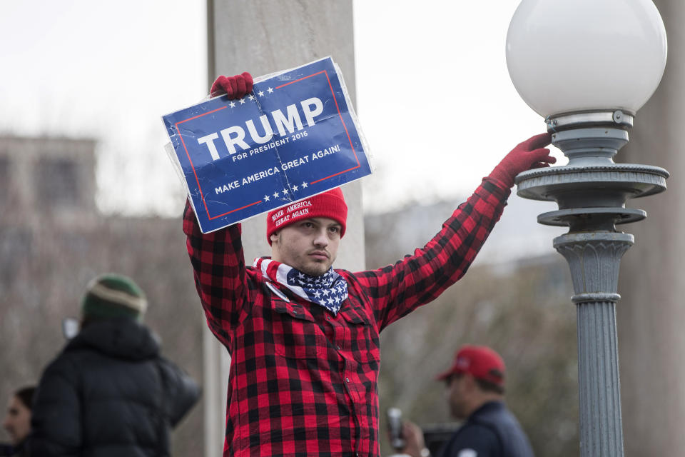 <p>A participant of an Alt-Right organized free speech event holds a Trump campaign sign on the Boston Common on Nov. 18, 2017, in Boston, Mass. (Photo: Scott Eisen/Getty Images) </p>