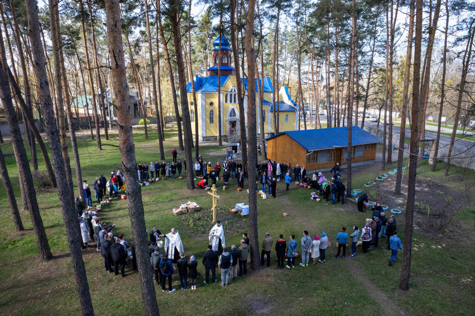 Priests perform blessings while celebrating Orthodox Easter outside a war-damaged church in Irpin, Ukraine, on April 24, 2022.