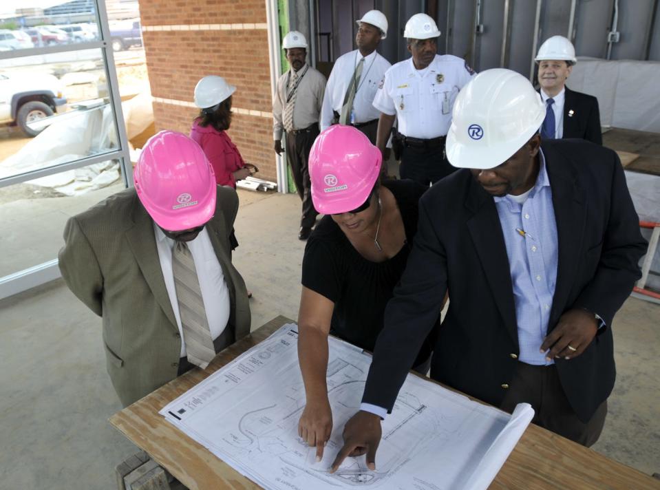 Chester Mallory (From left), Tammy Fleming and Cedric Campbell look at plans for ongoing construction at the Montgomery Regional Airport on Tuesday, May 11, 2010. (Montgomery Advertiser, Amanda Sowards)