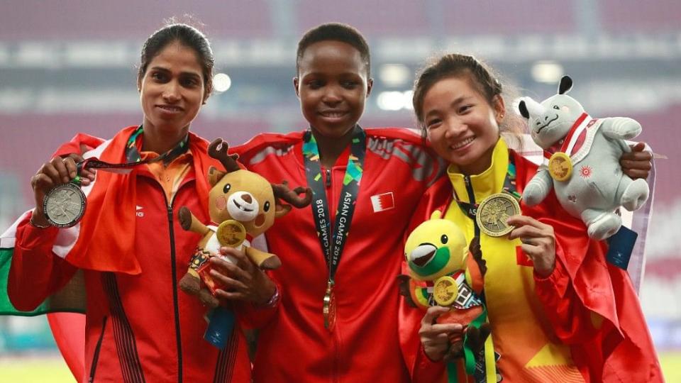 Sudha Singh (L) in the podium after 3000m steeplechase event at the 2018 Asian Games.