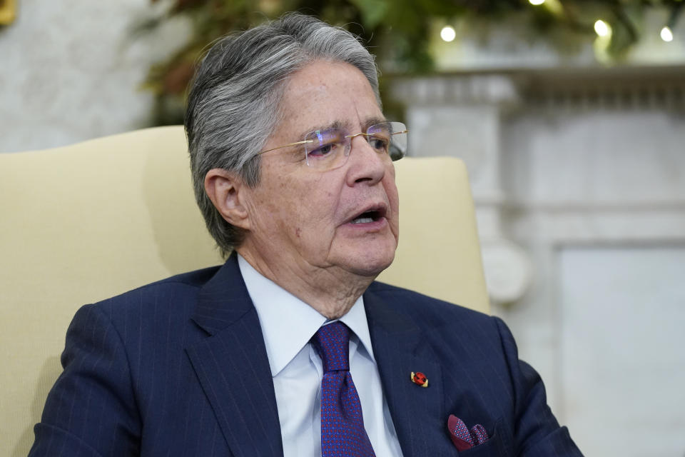 Ecuador's President Guillermo Lasso speaks during a meeting with President Joe Biden in the Oval Office of the White House, Monday, Dec. 19, 2022, in Washington. (AP Photo/Patrick Semansky)