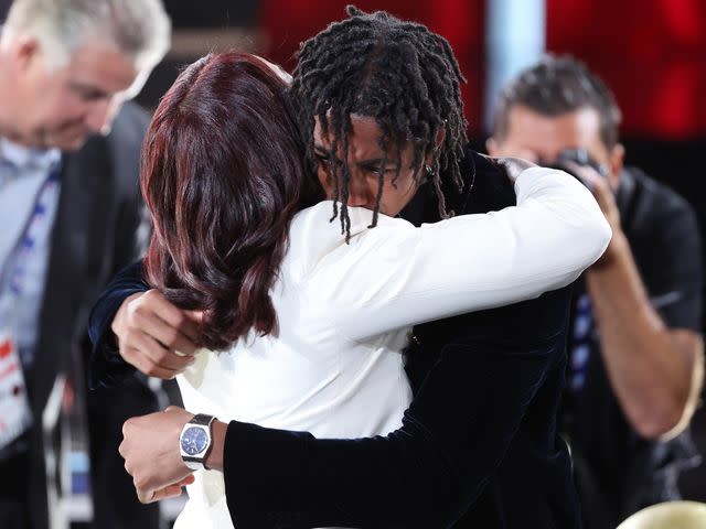 <p>Jeff Haynes/NBAE/Getty</p> Jaden Ivey and Niele Ivey hug during the 2022 NBA Draft.