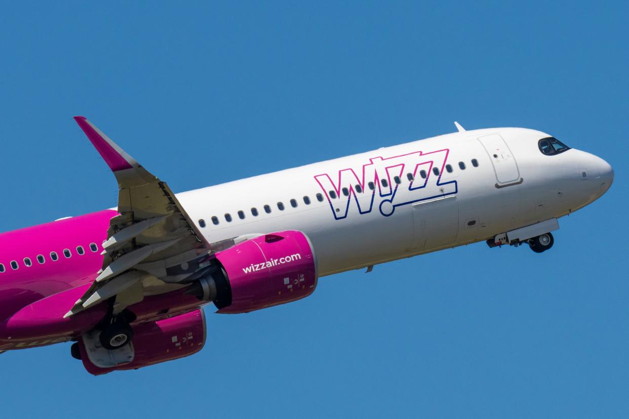 Wizz Air Malta Airbus A321 neo aircraft spotted at Eindhoven Airport during taxiing, taking off and flying phase in the blue sky.