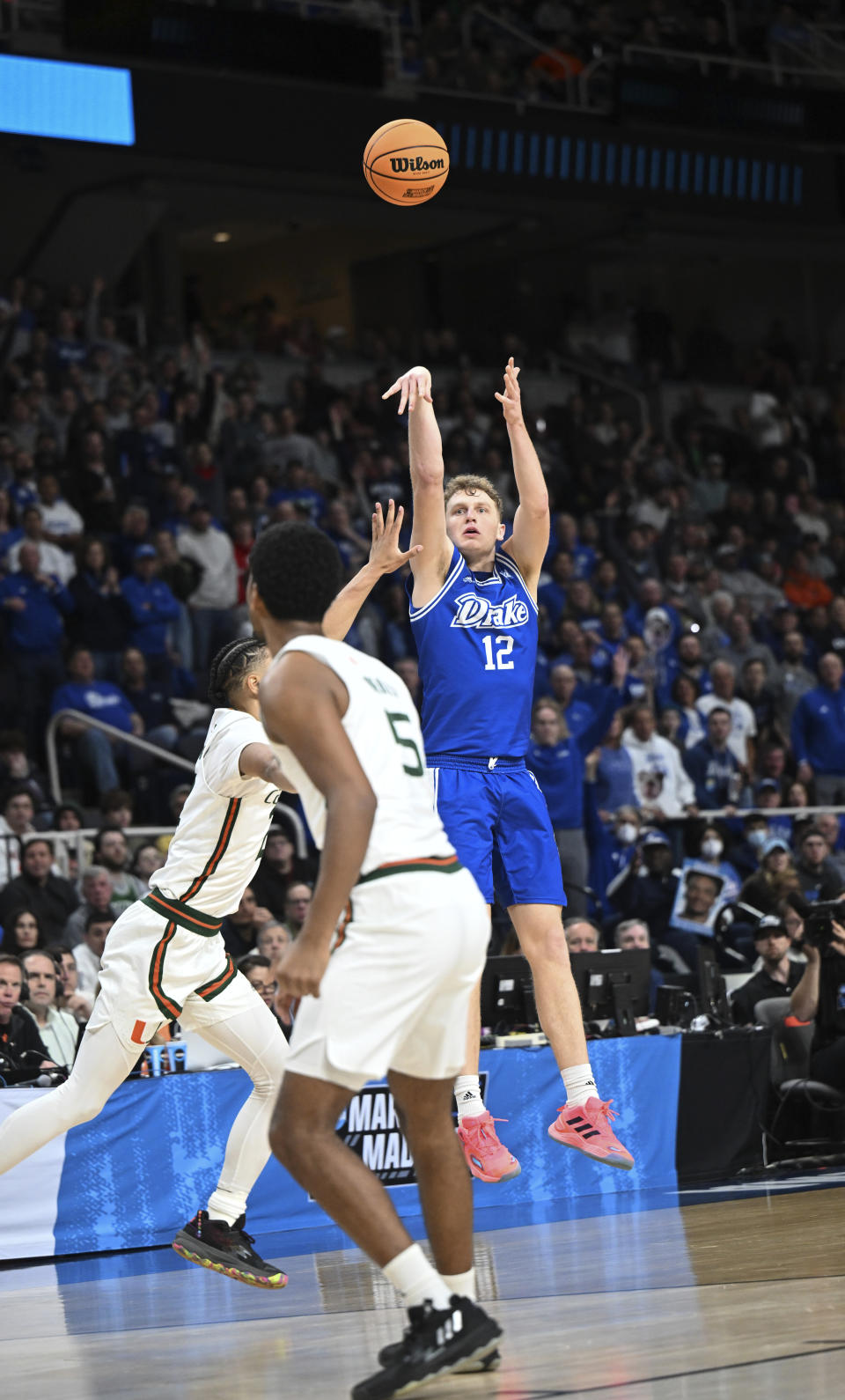 FILE - Drake guard Tucker DeVries (12) shoots and scores against Miami during the first half of a first-round college basketball game in the NCAA Tournament Friday, March 17, 2023, in Albany, N.Y. DeVries, the son of Drake coach Darian DeVries, was the 2022-23 winner of the Larry Bird Trophy given annually to the Missouri Valley Conference’s top player. (AP Photo/Hans Pennink, File)