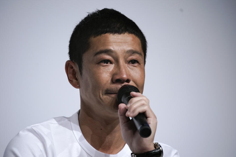 Zozo founder, Yusaku Maezawa, pauses as tears well in his eyes during a news conference Thursday, Sept. 12, 2019, in Tokyo. Yahoo Japan Corp. said Thursday, Sept. 12, 2019, it will put up a tender offer, estimated at 400 billion yen ($3.7 billion), for Zozo Inc., a Japanese online retailer started by a celebrity tycoon. (AP Photo/Jae C. Hong)