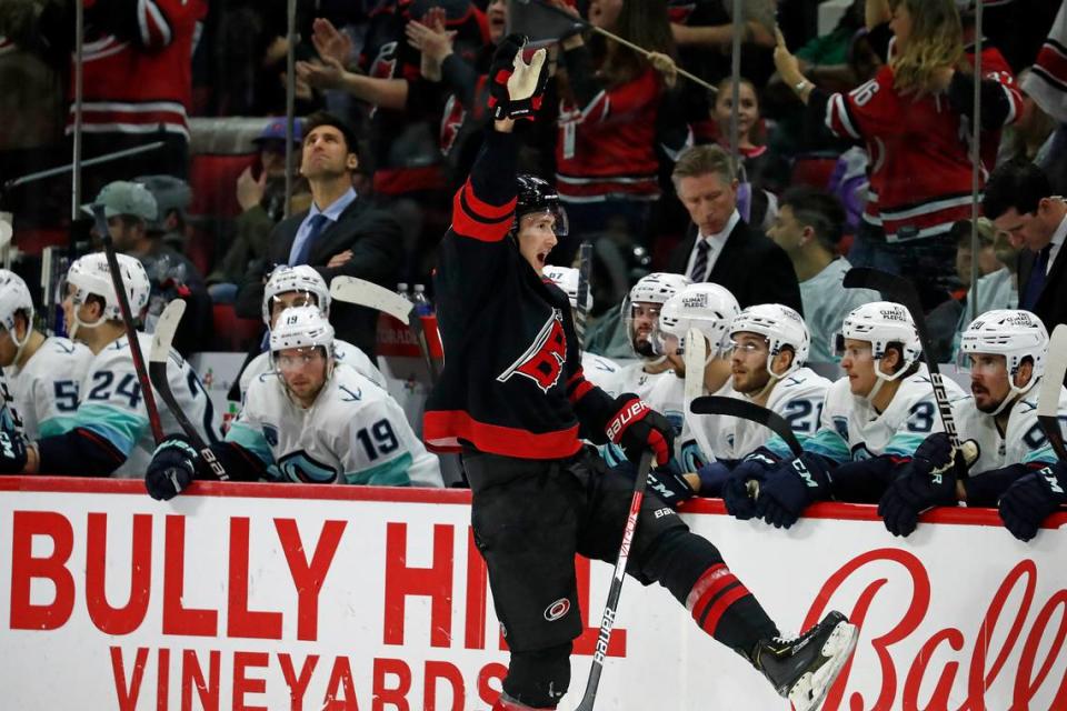 Carolina Hurricanes’ Martin Necas (88) celebrates his goal as he skates past the Seattle Kraken bench during the third period of an NHL hockey game in Raleigh, N.C., Sunday, March 6, 2022. (AP Photo/Karl B DeBlaker)