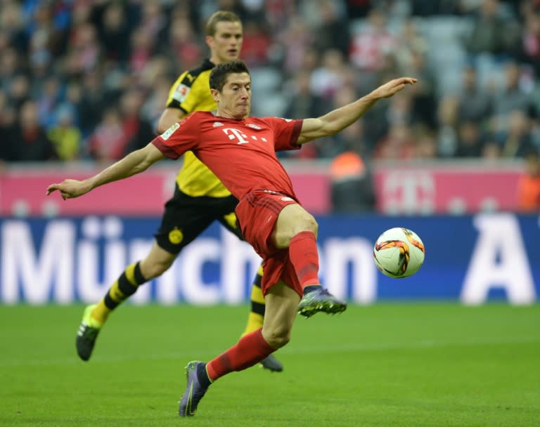 Bayern Munich's striker Robert Lewandowski plays the ball during a German first division Bundesliga football match against Borussia Dortmund in Munich, southern Germany, on October 4, 2015