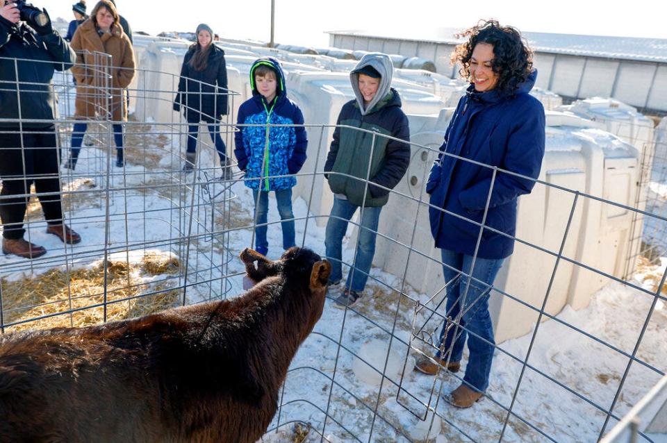 U.S. Department of Agriculture Rural Development Under Secretary Xochitl Torres Small, right, looks at Randy, one of the steer calves, shown to her by Cole Schulte, 9, third from right and his brother Caleb, 12, second from right in rural Norway, Iowa, on Wednesday, Feb. 1, 2023. Torres, a former Democratic congresswoman from New Mexico, has been nominated to serve as the next deputy secretary for the U.S. Department of Agriculture, announced by the agency and members of New Mexico's congressional delegation on Wednesday, Feb. 15, 2023.