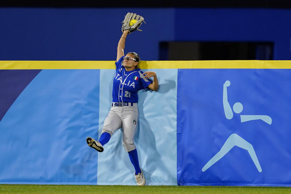 Italy's Laura Vigna catches a fly out during a softball game against Japan at Yokohama Baseball Stadium during the 2020 Summer Olympics, Saturday, July 24, 2021, in Yokohama, Japan. (AP Photo/Matt Slocum)