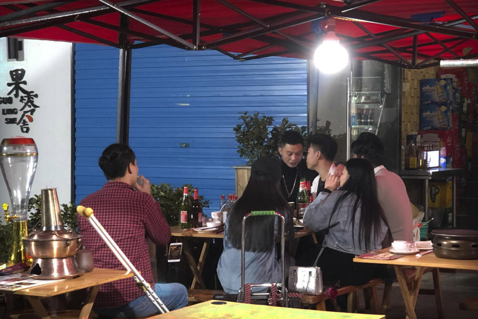 In this Dec. 6, 2019 photo, Wu Yi, who has struggled with Oxycontin abuse, sings a song for customers at an all-night restaurant in Shenzhen in southern China's Guangdong Province. Officially, pain pill abuse is an American problem, not a Chinese one. But people in China have fallen into opioid abuse the same way many Americans did, through a doctor's prescription. And despite China's strict regulations, online trafficking networks, which facilitated the spread of opioids in the U.S., also exist in China. (AP Photo/Mark Schiefelbein)