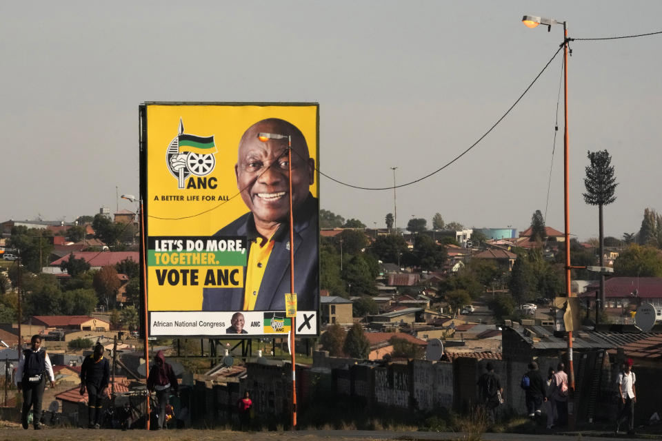 An election poster, with President Cyril Ramaphosa atop a pole in Soweto, South Africa, Monday, April 22, 2024. South Africans celebrate "Freedom Day" every April 27, when they remember their country's pivotal first democratic elections in 1994 that announced the official end of the racial segregation and oppression of apartheid. (AP Photo/Themba Hadebe)