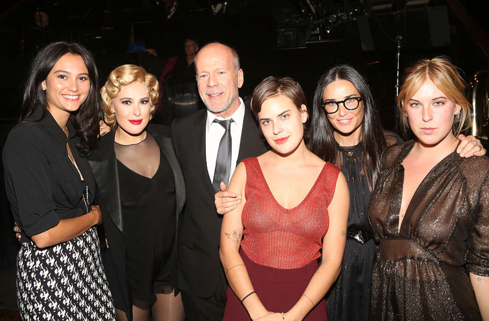 Demi Moore said she's "proud" of her divorce from ex-husband Bruce Willis and the relationship they've built (From left to right, Emma Heming Willis, Rumer Willis, Bruce Willis, Tallulah Willis, Demi Moore and Scout Willis). Image via Getty Images. 