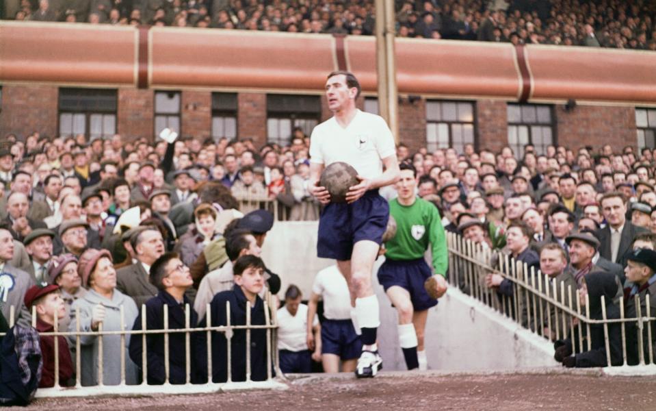 Tottenham Hotspur Double Winning Season. FA Cup Semi Final v Burnley. Danny Blanchflower leads the team out followed by goalkeeper Bill Brown. - Daily Herald/Mirrorpix/Mirrorpix via Getty Images