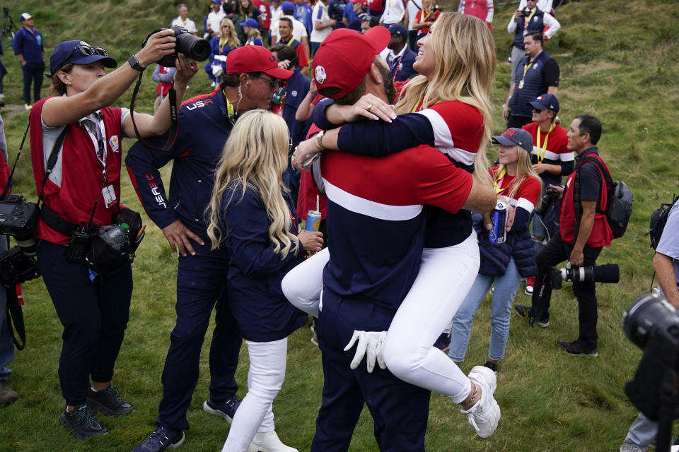 Team USA's Dustin Johnson celebrates with Paulina Gretzky after the Ryder Cup matches at the Whistling Straits Golf Course Sunday, Sept. 26, 2021, in Sheboygan, Wis. (AP Photo/Ashley Landis)