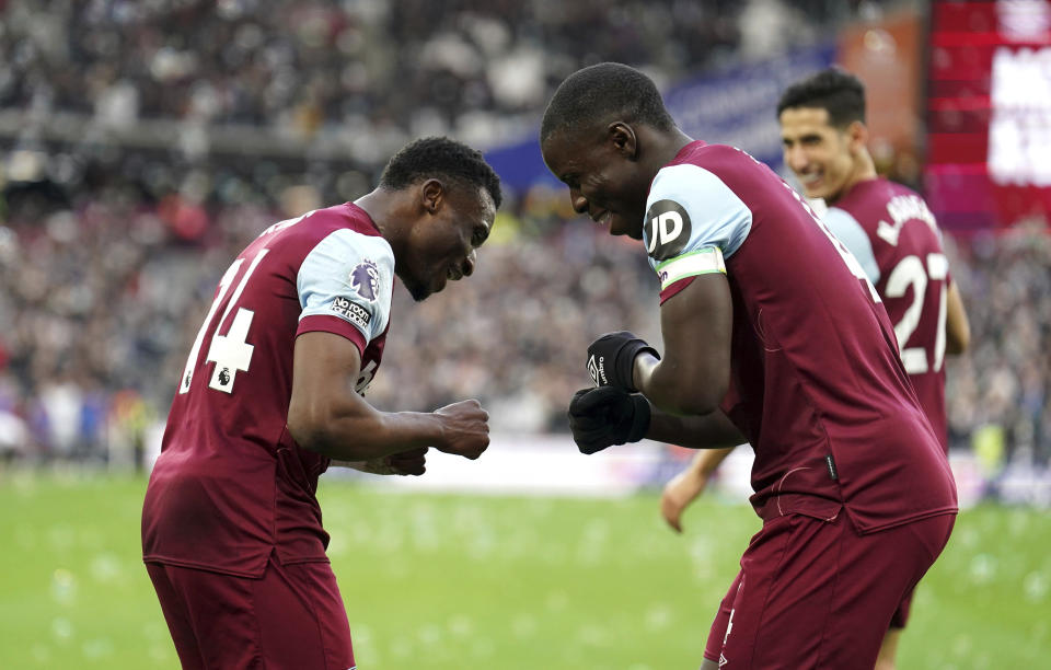 West Ham United's Mohammed Kudus, left, celebrates scoring during the English Premier League soccer match between West Ham United and Wolverhampton Wanderers at the London Stadium, London, Sunday Dec. 17, 2023. (Mike Egerton/PA via AP)