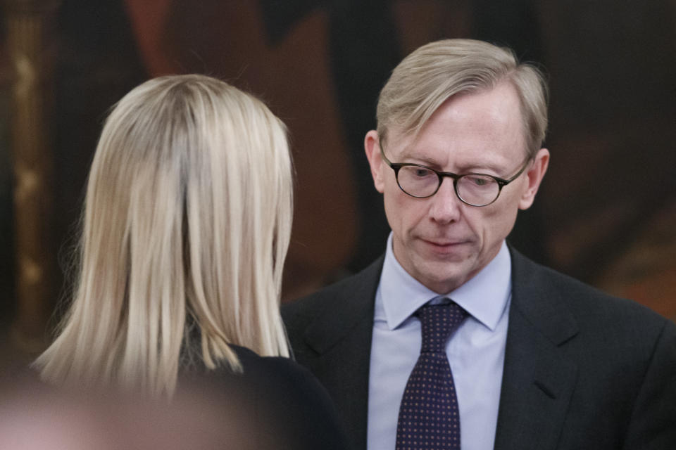 Ivanka Trump, left, the daughter and assistant to President Donald Trump, talks with Brian Hook, U.S. special representative for Iran, talk before an event with President Donald Trump and Israeli Prime Minister Benjamin Netanyahu in the East Room of the White House in Washington, Tuesday, Jan. 28, 2020, to announce the Trump administration's much-anticipated plan to resolve the Israeli-Palestinian conflict. (AP Photo/Alex Brandon)