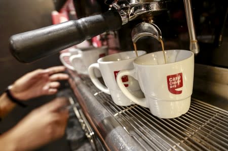 FILR PHOTO: An employee prepares coffee for customers at a Cafe Coffee Day outlet in Mumbai