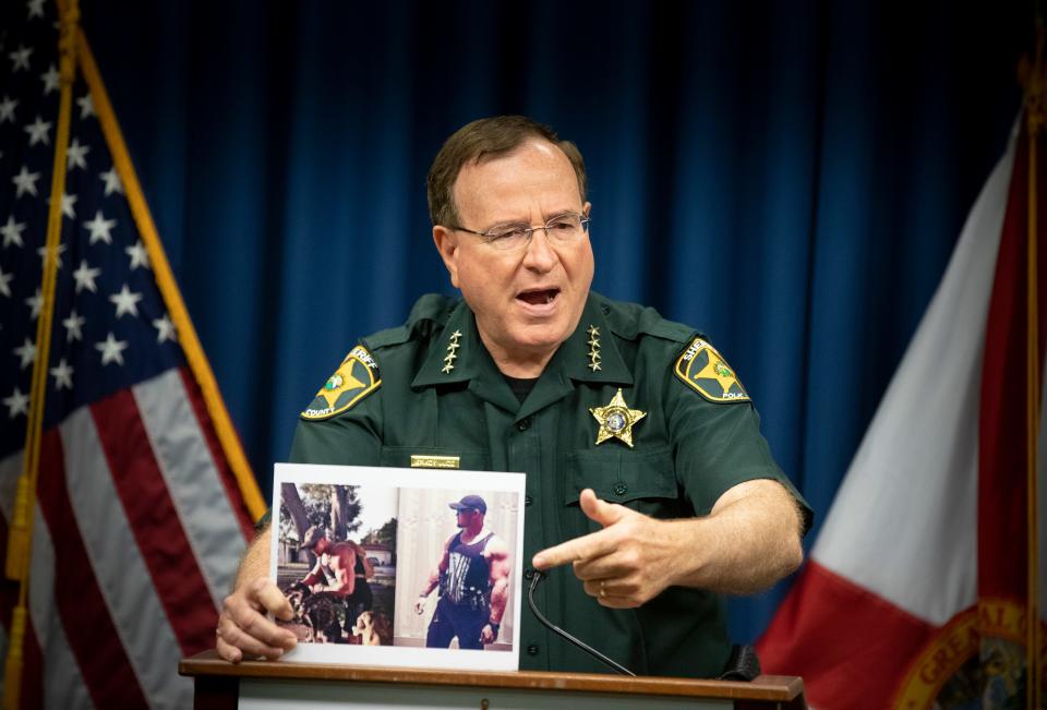 Polk County Sheriff Grady Judd points to a photograph of quadruple homicide suspect Bryan Riley during a press update at the Sheriff's Operation Center in Winter Haven  on Thursday Sept. 9 2021. Bryan Riley, 33, of Brandon killed Justice Gleason, 40, Theresa Lanham, 33, and their 3-month-old baby boy as well as wounding an 11-year-old girl in the same home in their home on North Socrum Loop Road about 4:30 a.m. Sunday.