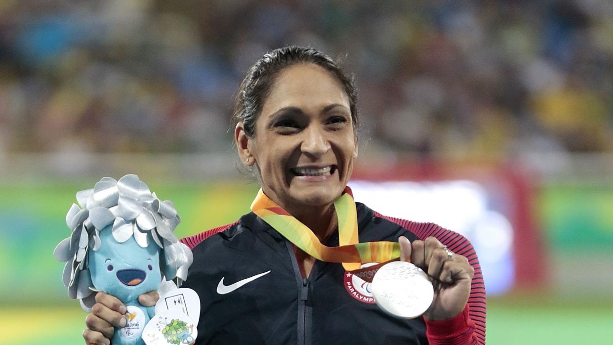 rio de janeiro, brazil september 11 silver medalist cheri madsen of united states celebrate on the podium at the medal ceremony for the womens 400m t54 final during day 4 of the rio 2016 paralympic games at the olympic stadium on september 11, 2016 in rio de janeiro, brazil photo by alexandre loureirogetty images