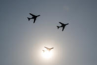 China's H-6 bomber jets fly in formation past the sun during a parade to commemorate the 70th anniversary of the founding of Communist China in Beijing, Tuesday, Oct. 1, 2019. China's Communist Party is celebrating its 70th anniversary in power with a parade showcasing its economic development and newest weapons. The event marks the anniversary of the Oct. 1, 1949, announcement of the founding of the People's Republic of China by then-leader Mao Zedong. (AP Photo/Andy Wong)