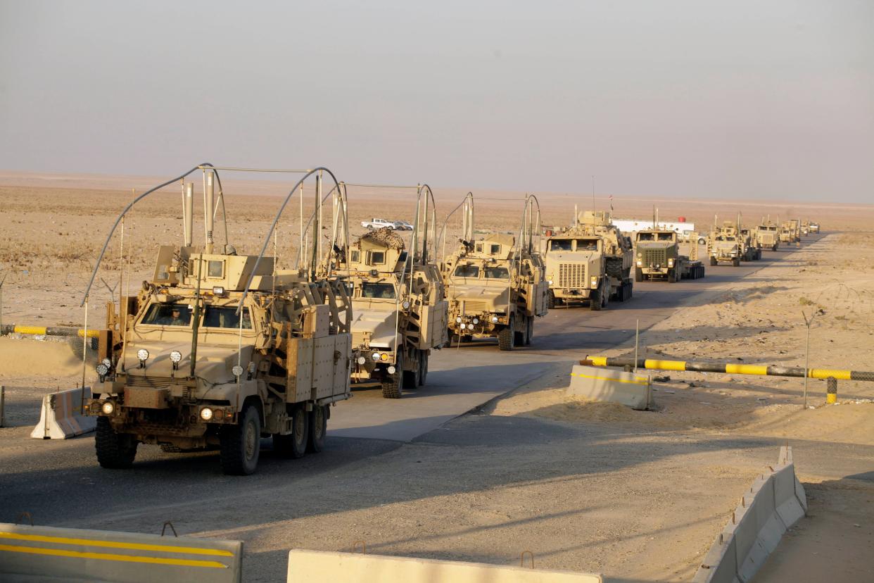 The last vehicles in a convoy of the U.S. Army's 3rd Brigade, 1st Cavalry Division cross the border from Iraq into Kuwait, on Dec. 18, 2011. The brigade's special troops battalion were the last American soldiers to leave Iraq.