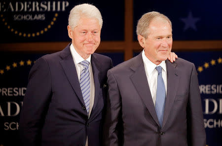 Former U.S. President Bill Clinton (L) and former U.S. President George W. Bush participate in a moderated conversation at the graduation class of the Presidential Leadership Scholars program at the George W. Bush Presidential Library in Dallas, Texas, U.S., July 13, 2017. REUTERS/Brandon Wade