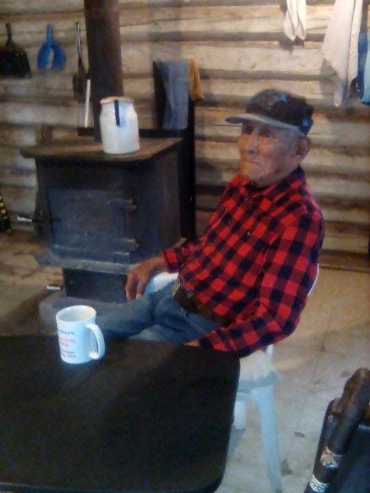 John Kinsel, Sr., sits inside his cabin in Lukachukai in northeast Arizona. Kinsel is one of the last remaining Navajo Code Talkers.